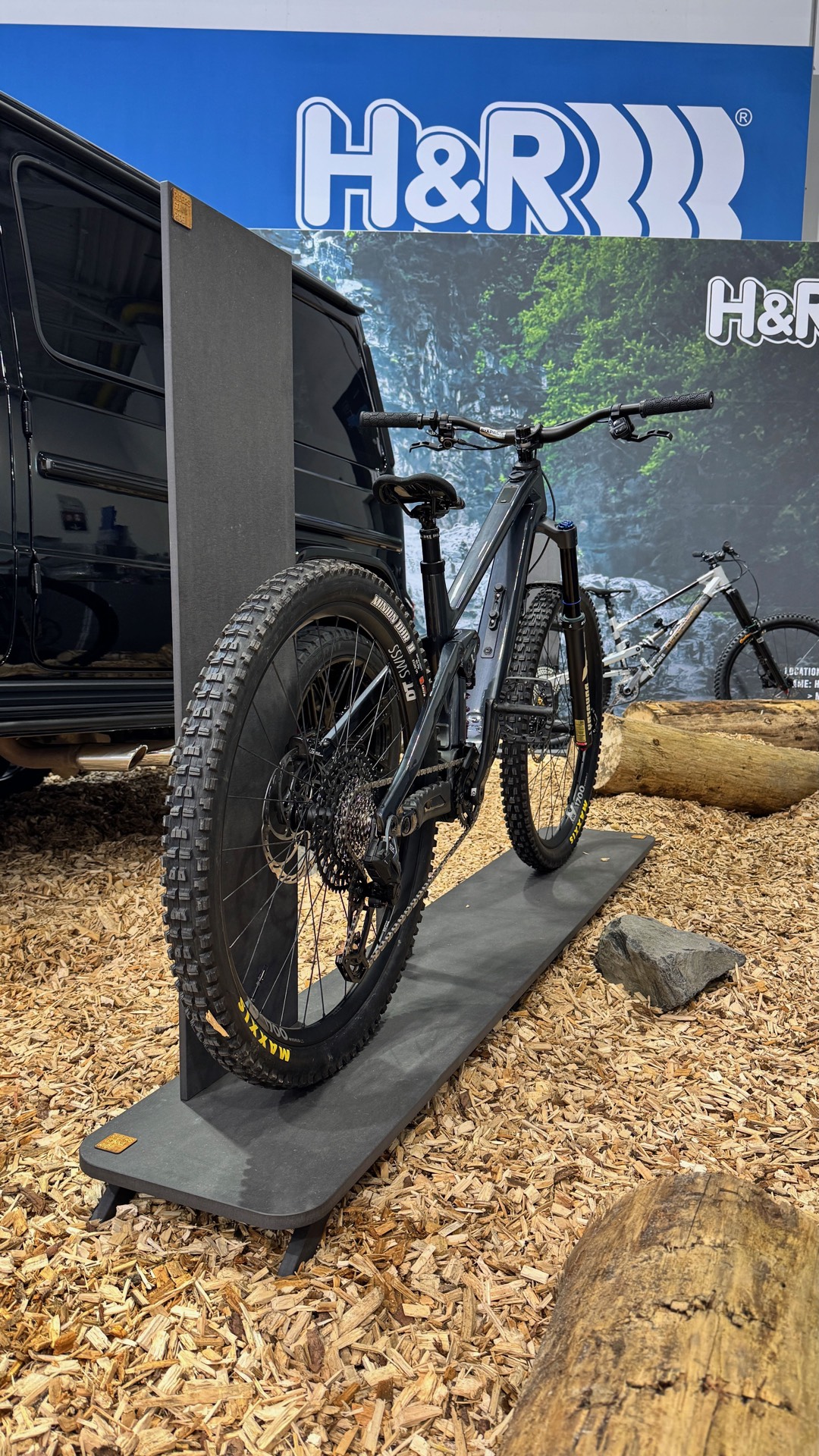 H&R Performance Springs — custom display piece holding a mountain bike at the H&R booth