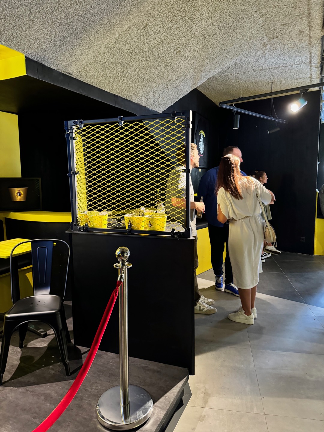 Loco Chicken — mesh counter with yellow cups