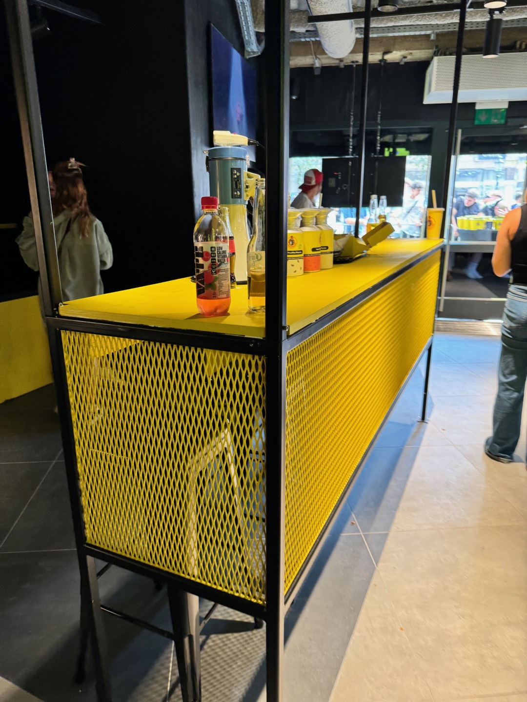 Loco Chicken — yellow counter front, store detail