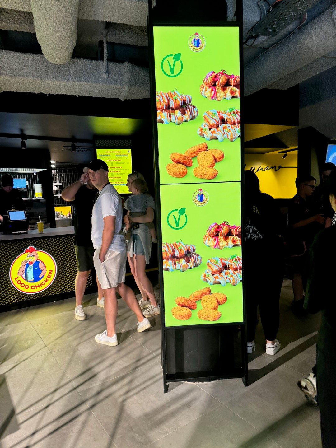 Loco Chicken — menu display & brand logo in the store