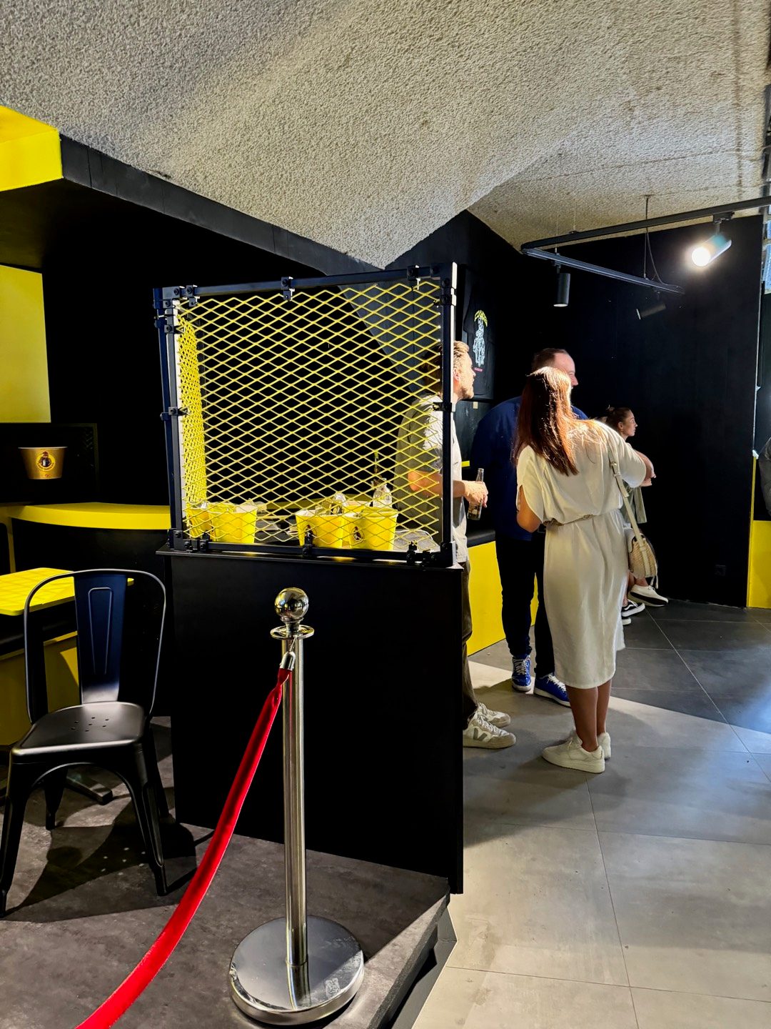 Loco Chicken — mesh counter with yellow cups