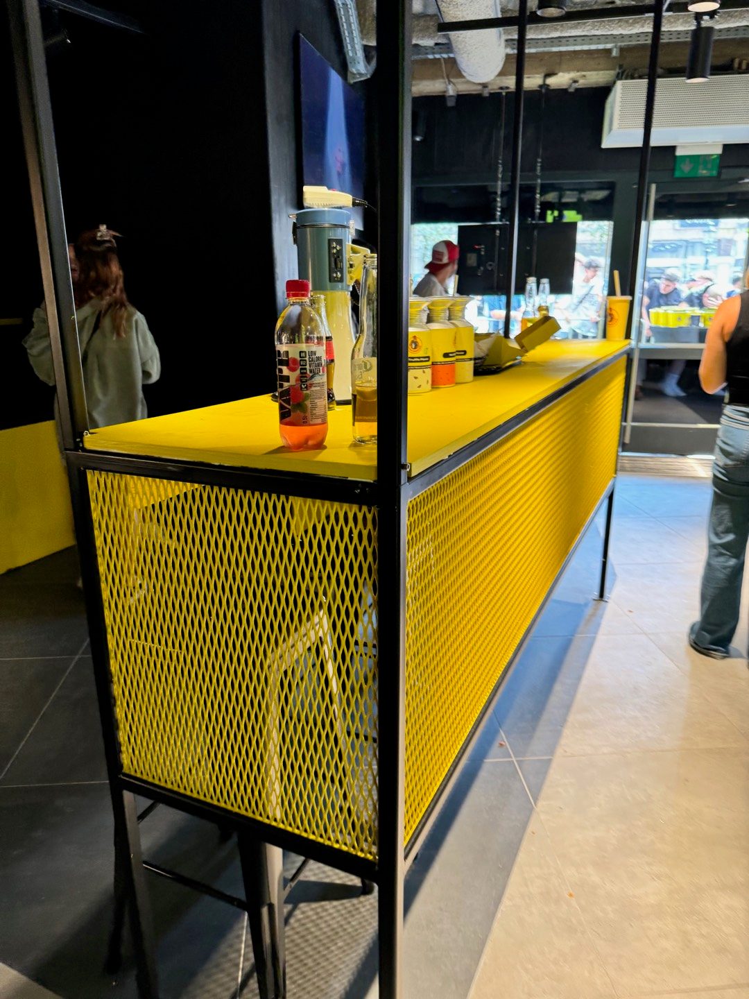 Loco Chicken — yellow counter front, store detail